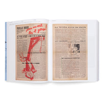 An overhead view of an open book displaying two aged, yellowed pages from a French publication. The left page, from Feuille Rouge, features a bold red graphic of a gallows and a hand with a sickle smashing a swastika. The right page is primarily text with a small black and white photograph.
