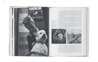 A black-and-white photograph of an open book. The left page features a large photo of a person in a turban and bow tie holding a fluffy white dog. The right page contains text and two smaller photos.