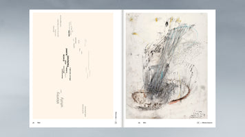 An open art book on a grey surface. The left page features a word cloud with terms like stormy, whirly, fractioned, and layered on a cream background. The right page displays an abstract drawing with energetic, scribbled lines in charcoal, blue, and yellow, illustrating the words on the left.