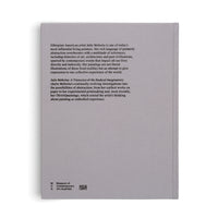 The light gray back cover of a book, shot at a slight angle against a white background. Black text describes the artist Julie Mehretu and the book's contents. The title reads, Julie Mehretu: A Transcore of the Radical Imaginary. At the bottom are the logos for the Museum of Contemporary Art Australia and publisher Hatje Cantz.