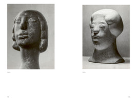 A black-and-white two-page spread from a book, showing pages 70 and 71. On the left, labeled Tafel 1, is a photograph of a dark, stylized sculpture of a head with a long neck and rounded hair. On the right, labeled Tafel 2, is a photograph of a light-colored, more rounded sculptural head with similar simple, prominent features.