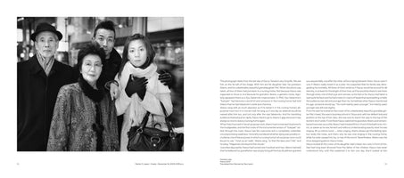 An open book spread. The left page features a black and white, close-up portrait of a multi-generational Japanese family of four. An elderly man in a fedora and an elderly woman in a patterned coat stand in front of a younger man and a young woman in a white scarf. The right page contains two columns of English text.