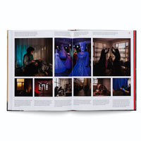 An angled view of an open book displaying a photo-essay across a two-page spread. The pages are laid out with multiple color photographs and French text, depicting various scenes of life in Afghanistan, including women in domestic settings, mannequins in elaborate dresses, and people dancing.
