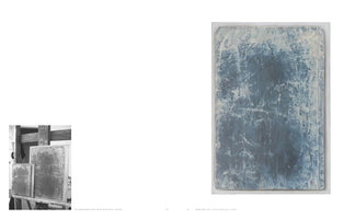 A two-page book spread. On the left, a small black-and-white photo shows two textured, abstract paintings on an easel. On the right is a large, full-color image of one of the paintings, a vertical abstract piece with a mottled, cracked surface in shades of deep blue and off-white.