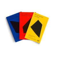 Three paperback books with minimalist covers are fanned out on a white background. The books have solid color covers in blue, red, and yellow, each featuring a large, abstract black shape. The titles are visible: On Architecture and Greenwashing, On Architecture and the Greenfield, and On Architecture and Work.