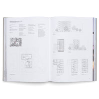Interior spread from an art book showing a black and white photograph of a modernist building with clean geometric lines and large windows, accompanied by German text on the facing page.