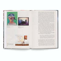 An open art book showing a two-page spread. The left page, numbered 86, features three artworks with German captions, including a colorful self-portrait by Maria Lassnig and two pieces by Tracey Emin. The right page, 87, contains a single column of German text. The book is laid on a plain white surface.